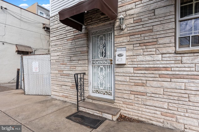 view of exterior entry with stone siding