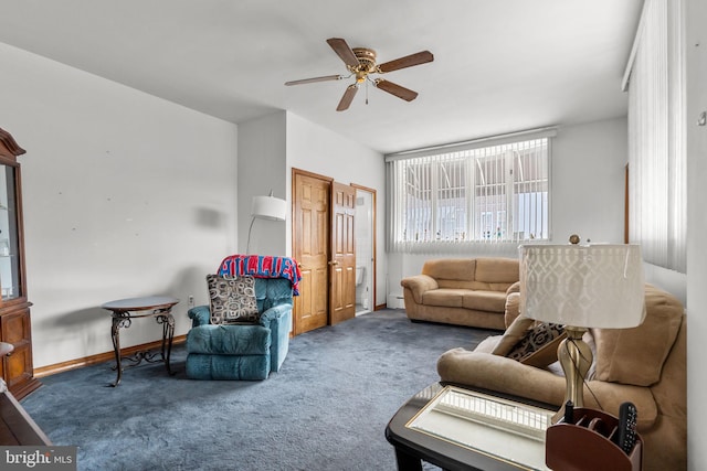 carpeted living area with baseboards, baseboard heating, and a ceiling fan