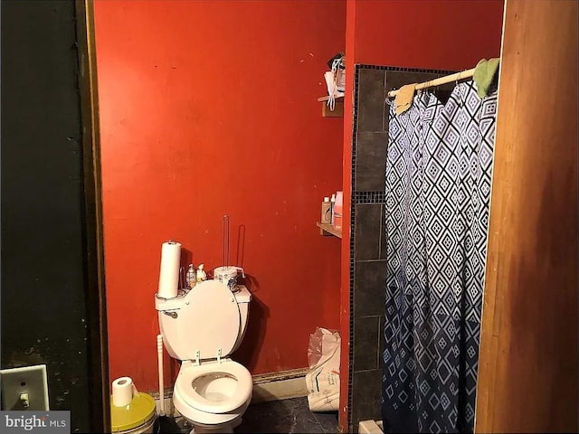 full bath with a shower with shower curtain and toilet