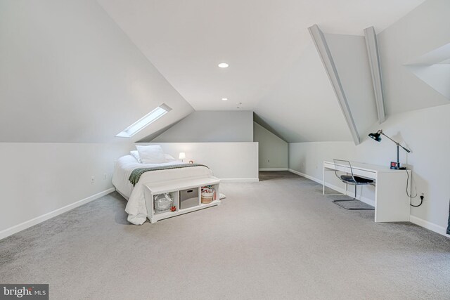 bedroom with recessed lighting, vaulted ceiling with skylight, baseboards, and carpet