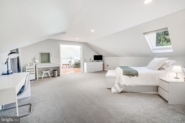 bedroom featuring recessed lighting, lofted ceiling with skylight, and light colored carpet