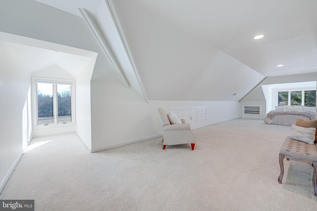 interior space featuring lofted ceiling, recessed lighting, carpet, and a wealth of natural light