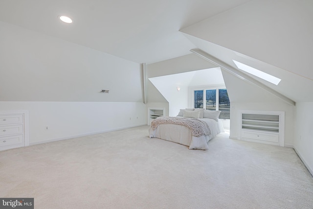 carpeted bedroom with vaulted ceiling with skylight, recessed lighting, baseboards, and visible vents