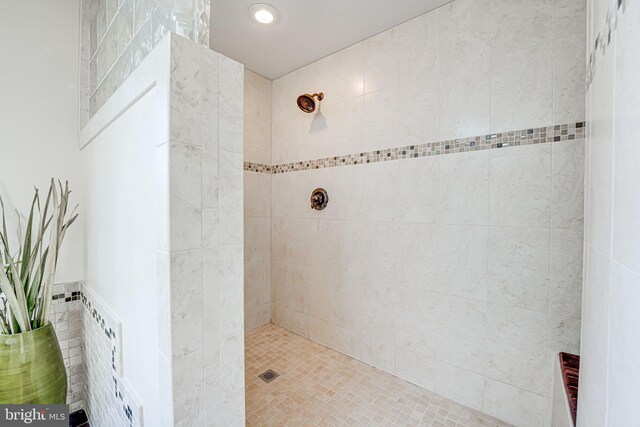 bathroom with a tile shower