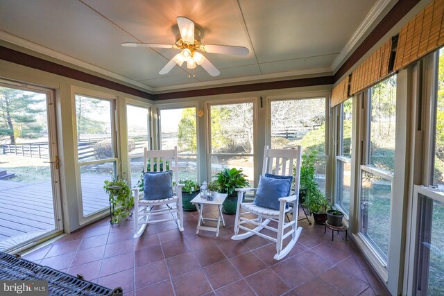 sunroom / solarium with ceiling fan