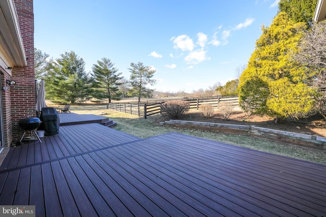 wooden terrace featuring fence