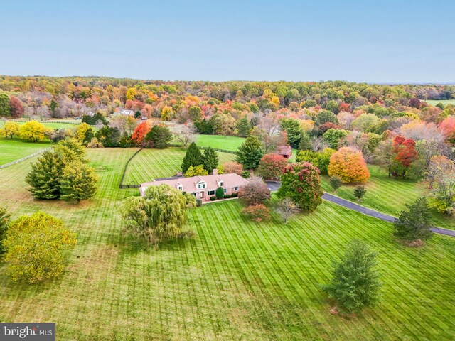 birds eye view of property with a rural view and a forest view