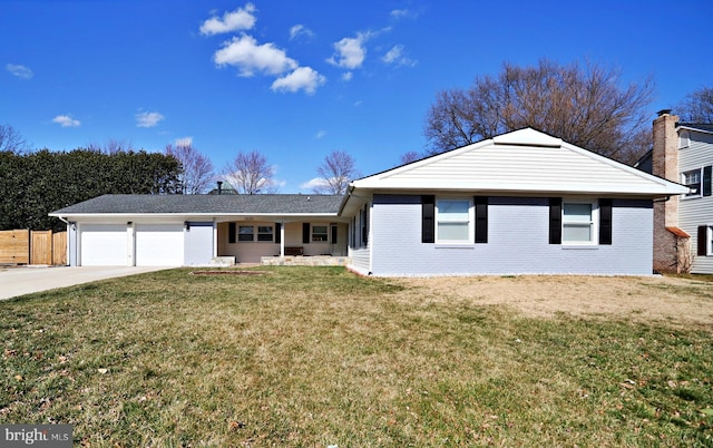 ranch-style home featuring a front lawn, fence, concrete driveway, an attached garage, and brick siding