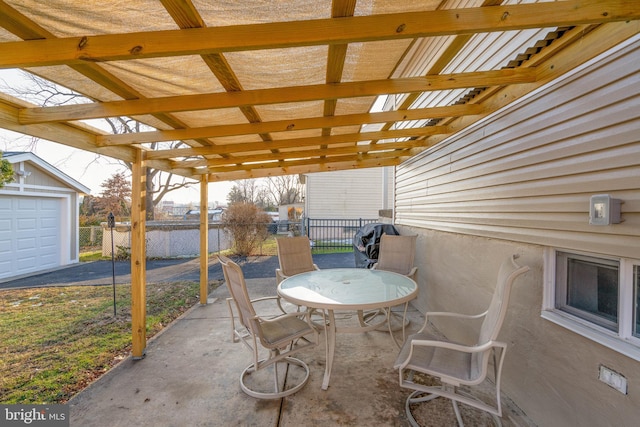 view of patio with outdoor dining space and fence