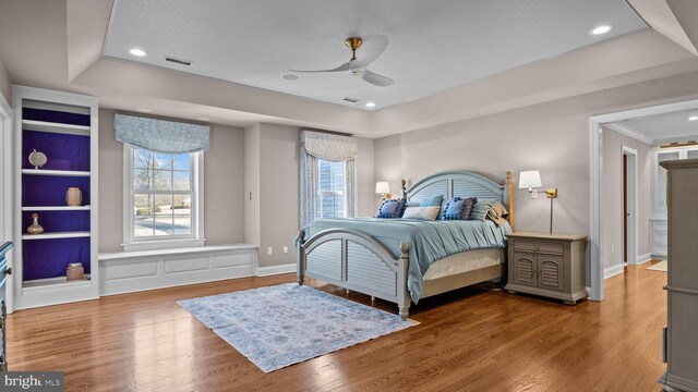 bedroom featuring visible vents, recessed lighting, and wood finished floors