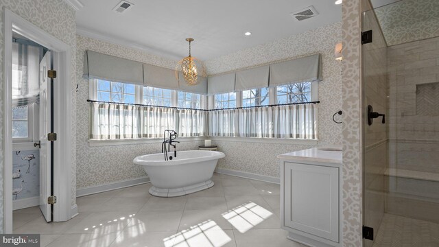 bathroom featuring wallpapered walls, a shower stall, and visible vents