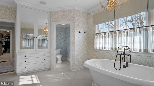 full bathroom with wallpapered walls, baseboards, ornamental molding, tile patterned floors, and a soaking tub