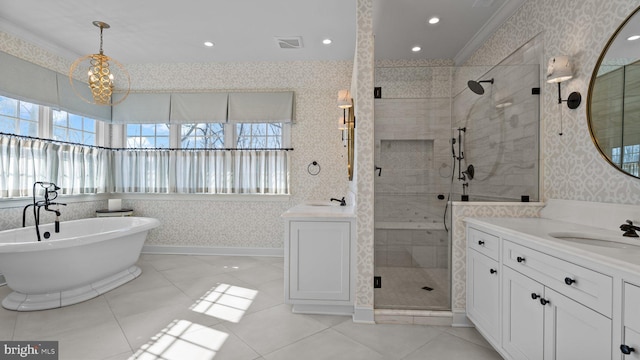 full bathroom with wallpapered walls, a shower stall, visible vents, and a sink