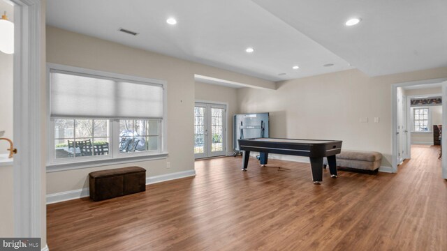 game room with wood finished floors, recessed lighting, french doors, and baseboards