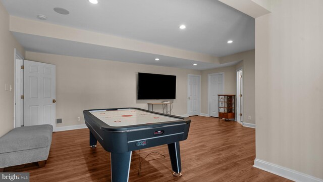 rec room with recessed lighting, wood finished floors, and baseboards