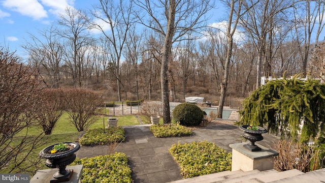 exterior space featuring a lawn, fence, and a gate