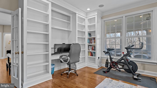 office featuring built in shelves, ornamental molding, wood finished floors, recessed lighting, and baseboards