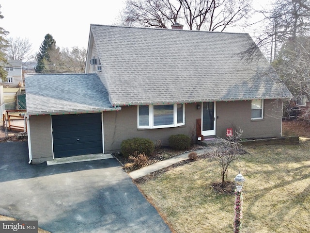 view of front of house with brick siding, a shingled roof, aphalt driveway, a chimney, and a garage