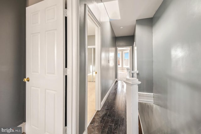 1636 N Bentalou St, Baltimore, MD 21216 - hall with dark wood finished floors, an upstairs landing, and baseboards