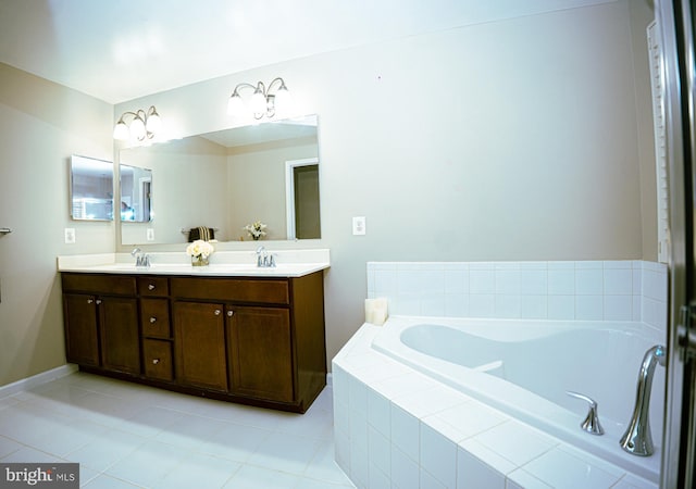 bathroom featuring double vanity, a sink, a bath, and tile patterned floors