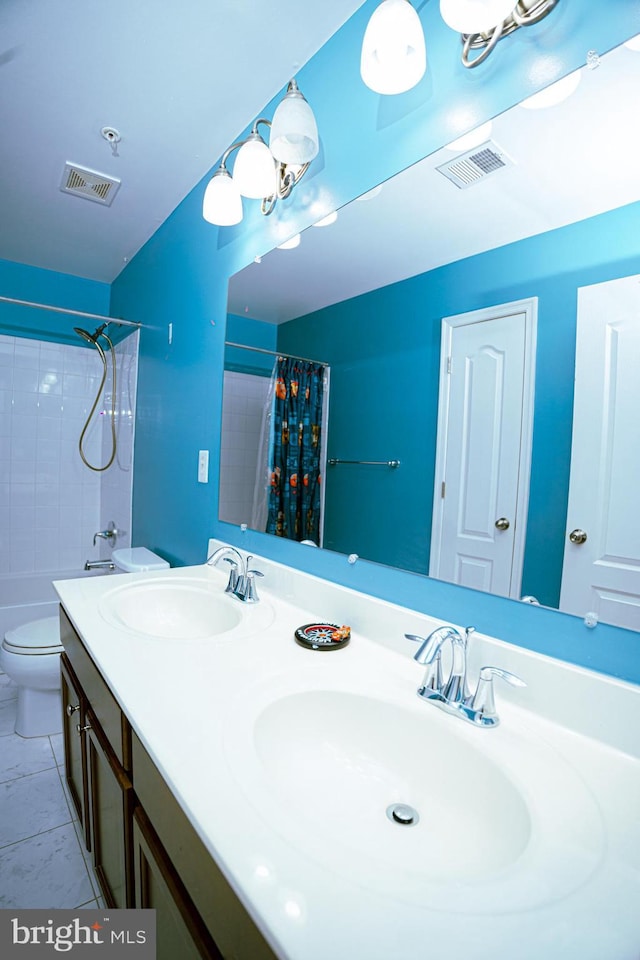 full bath featuring toilet, visible vents, and a sink