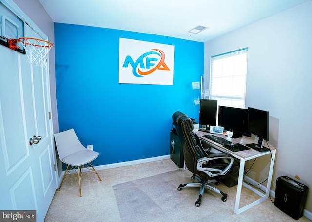 office space featuring carpet floors, visible vents, and baseboards