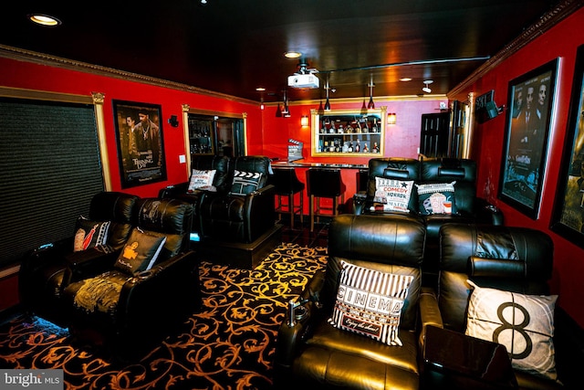 home theater room featuring a bar, recessed lighting, and crown molding