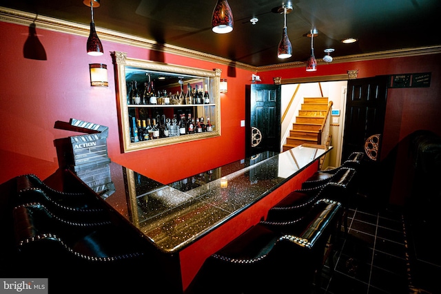 bar with a dry bar, stairway, and crown molding