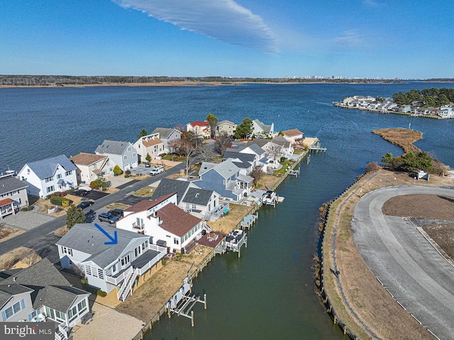 bird's eye view featuring a residential view and a water view