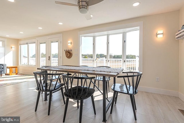 dining space featuring ceiling fan, recessed lighting, light wood-type flooring, and baseboards