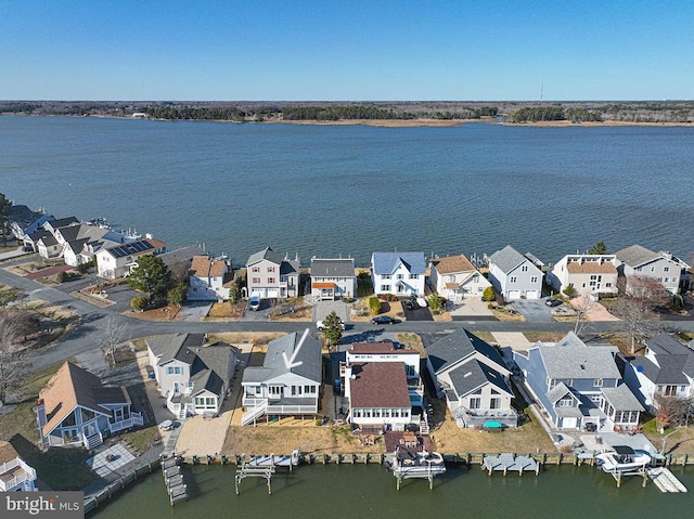 birds eye view of property with a residential view and a water view