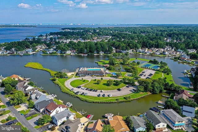 birds eye view of property with a water view and a residential view