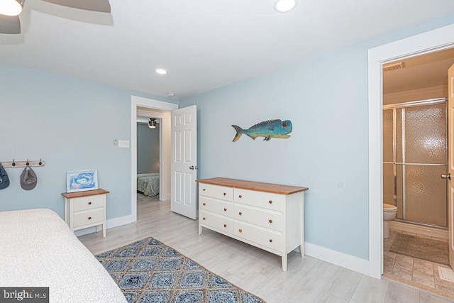 bedroom featuring baseboards, recessed lighting, ensuite bath, and light wood-style floors