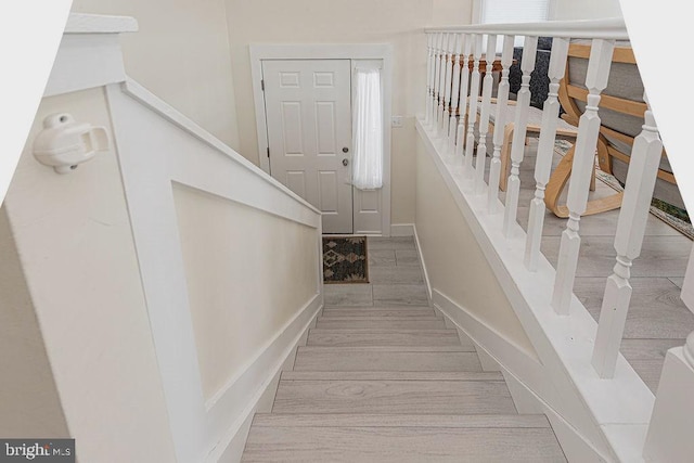 stairs featuring baseboards