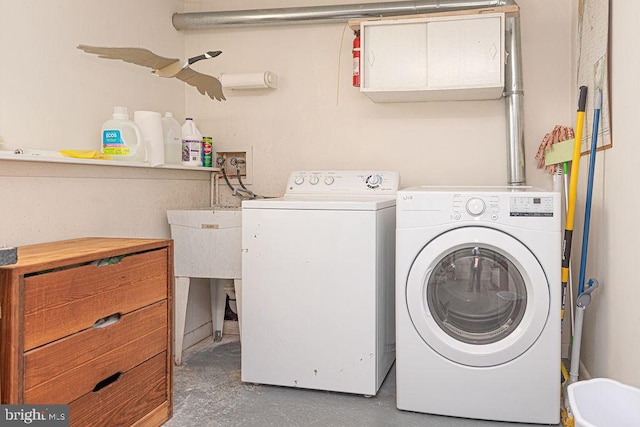 laundry area with laundry area and washer and dryer