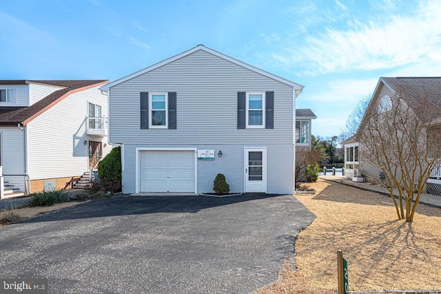 view of front of home with driveway and an attached garage