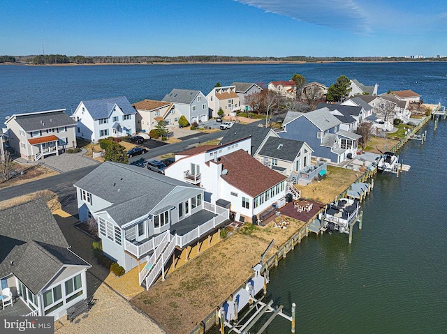 aerial view featuring a water view and a residential view