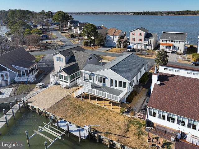 bird's eye view featuring a residential view and a water view