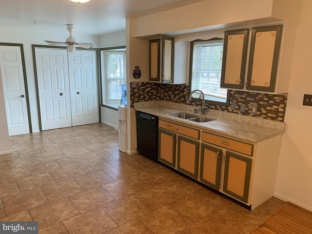 kitchen featuring a sink, a ceiling fan, baseboards, dishwasher, and tasteful backsplash