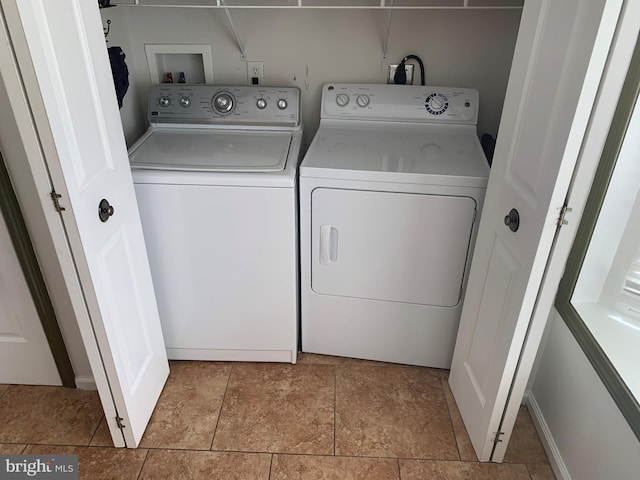 washroom with washer and dryer and laundry area