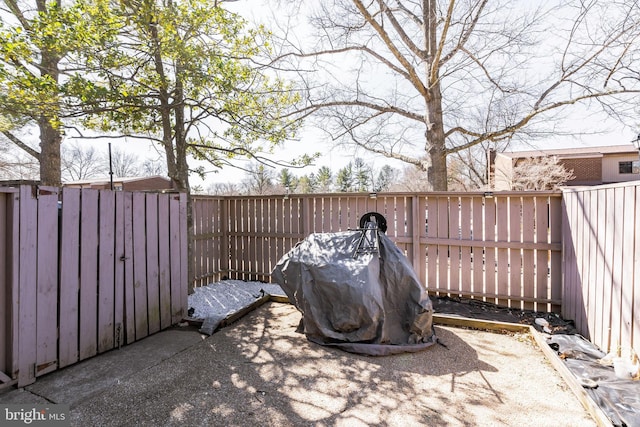 view of patio featuring a grill and a fenced backyard