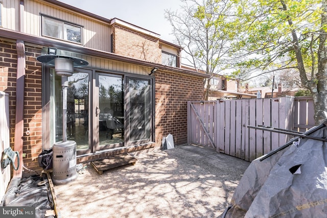 view of patio / terrace featuring fence and a gate