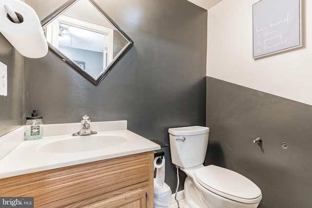 bathroom with toilet and vanity