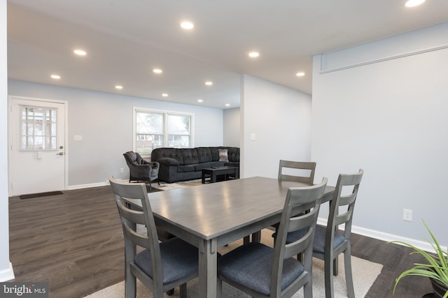 dining area featuring recessed lighting, dark wood finished floors, and baseboards