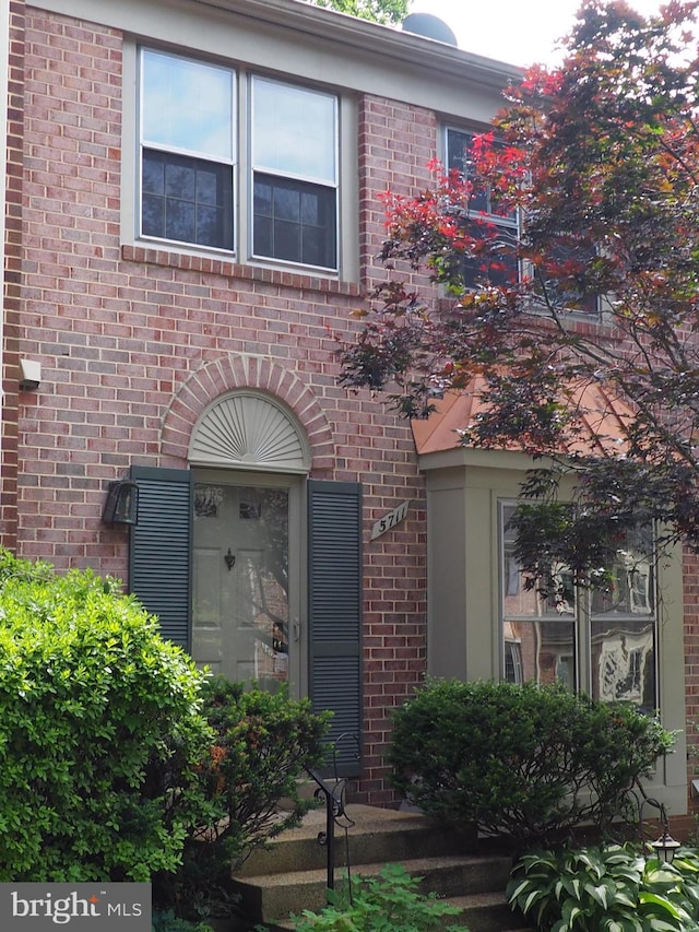 5711 Crownleigh Ct, Burke, VA 22015 - doorway to property featuring brick siding