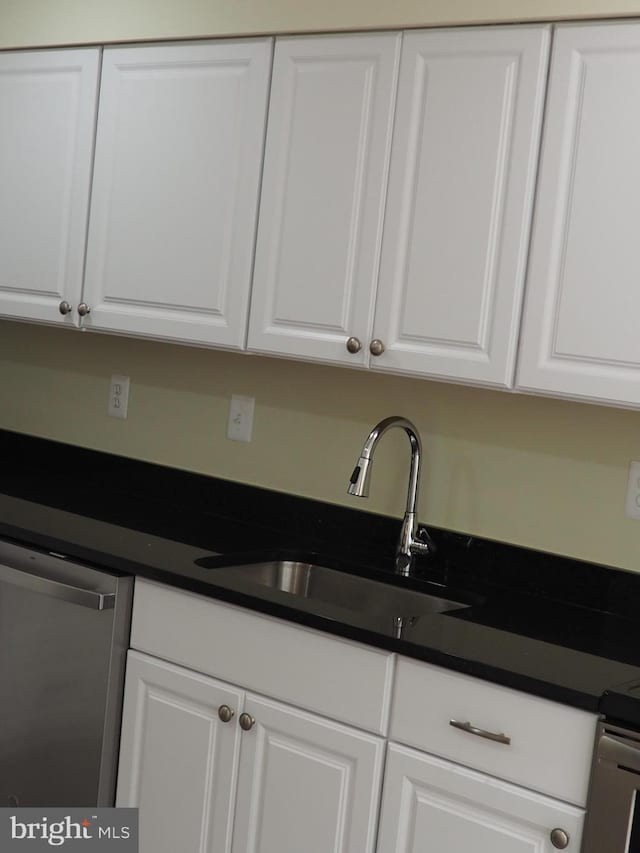 5711 Crownleigh Ct, Burke, VA 22015 - kitchen with a sink, stainless steel dishwasher, white cabinets, and dark countertops