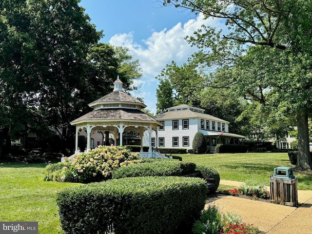 exterior space featuring a front lawn and a gazebo