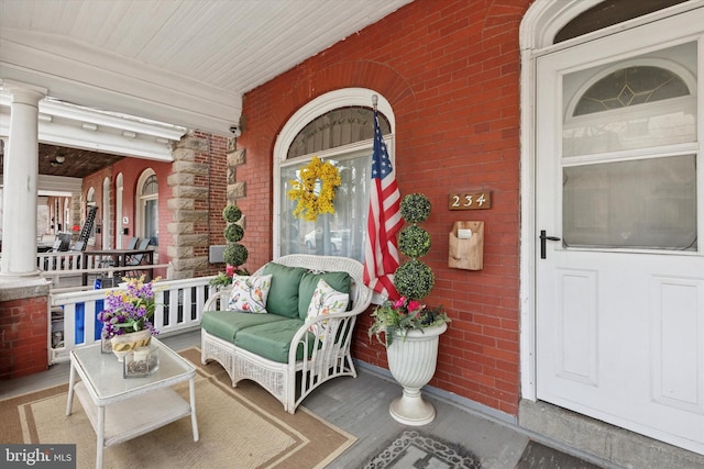 entrance to property featuring covered porch