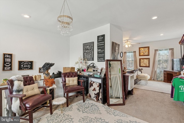 interior space featuring recessed lighting, carpet flooring, and ceiling fan with notable chandelier