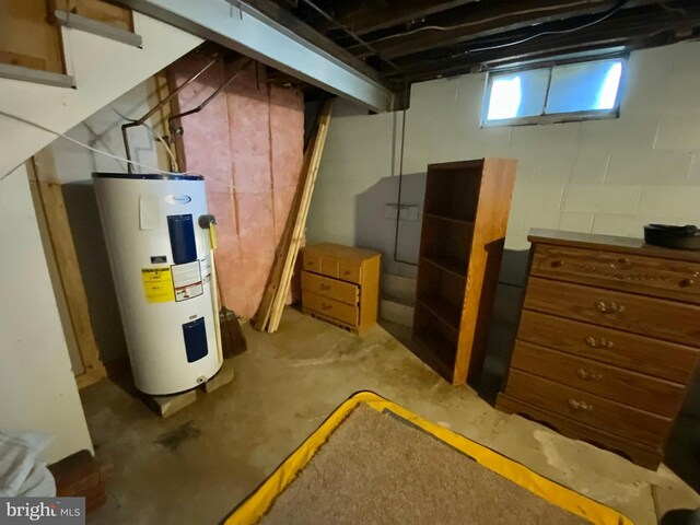 below grade area featuring electric water heater